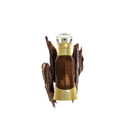 Dehn Al Oud Qadeem EDP 40mL by Ahmed Al Maghribi. Oud Pieces cab be seen in the white background.