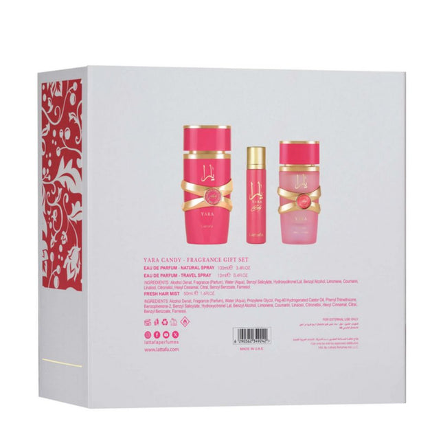Fragrance gift set packaging with pink bottles and decorative design on a white background.  It is Lattafa Yara Candy 3-in-1 Gift Set | Includes 100ml EDP, 12ml EDP, and Hair Mist