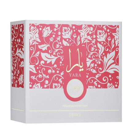 Yara perfume box with pink and white floral design. It is  Lattafa Yara Candy 3-in-1 Gift Set | Includes 100ml EDP, 12ml EDP, and Hair Mist