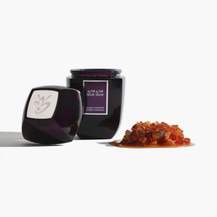 Luban Shay Shay 120g Jar with some of its frankincense content kept besides it.