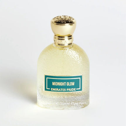 Perfume bottle labeled 'Midnight Glow Emirates Pride' with a gold cap on a white background. It is a EDP 100mL Spray.