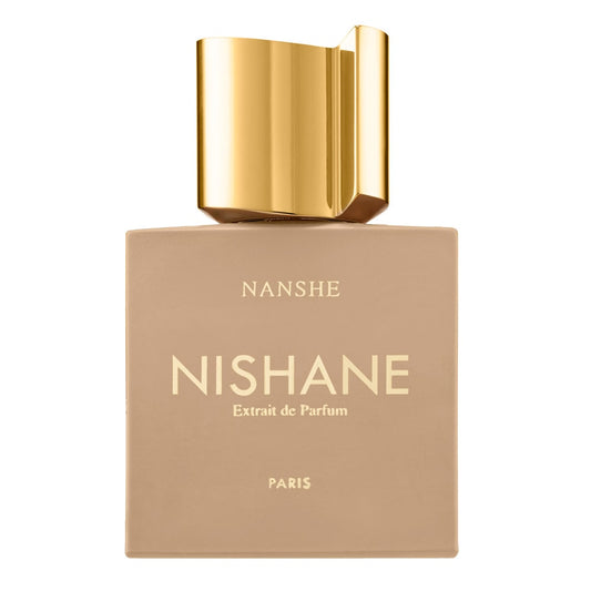 Nishane perfume bottle with gold cap on a beige background