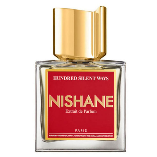 Nishane perfume bottle with gold cap and red label on a white background