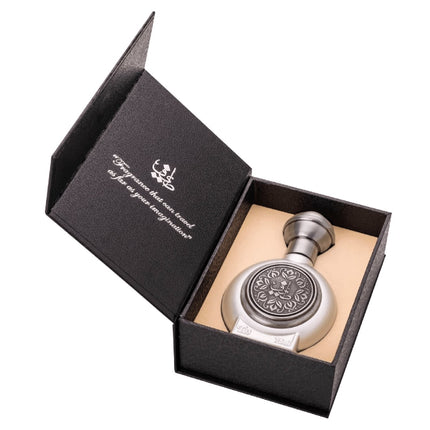 Silver decorative object in a black box with text on a white background. It is Taif Al Emarat's T03 EDP 75mL