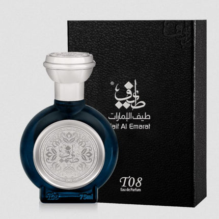 Perfume bottle with silver cap and intricate design next to a black box with brand logo on a light gray background. It is T08 Theyab EDP 75mL by Taif Al Emarat.