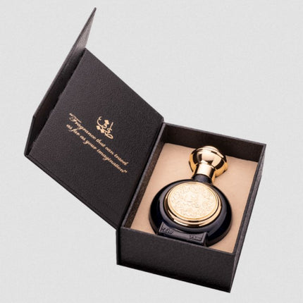 Perfume bottle with gold cap in a black box on a light gray background. It is T10 EDP spray by Taif Al Emarat.