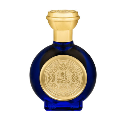 Blue perfume bottle with gold cap and decorative label on a light gray background. It is T10 EDP spray by Taif Al Emarat.